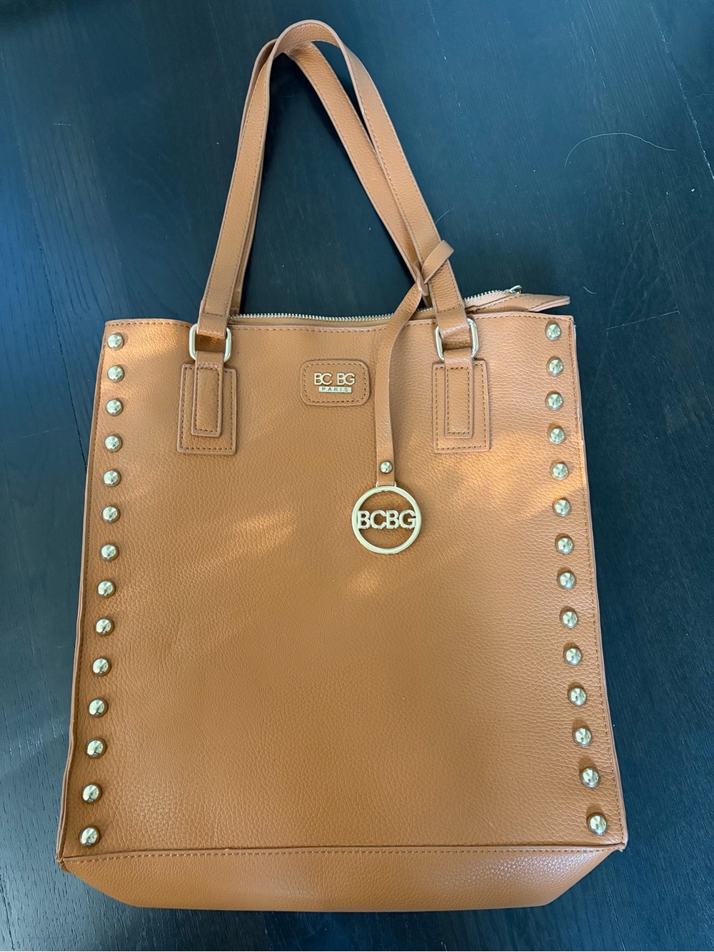 BCBG Cognac Studded Tote with Gold Logo Charm. Brand new no tag